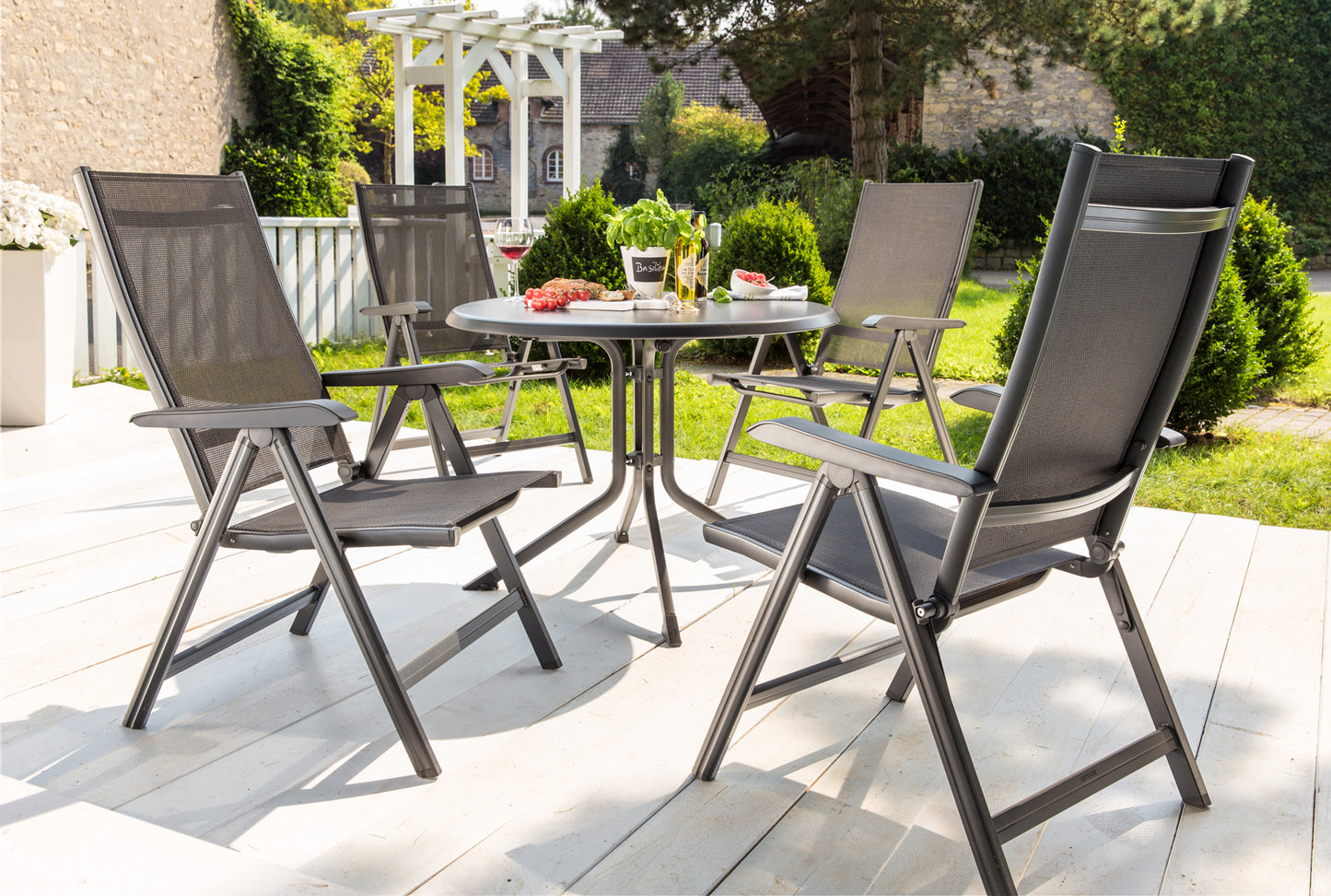 Kettler Basic Plus Outdoor Multi-Position Chair around the table