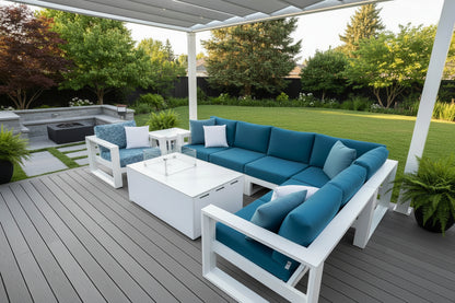 Blue sectional sofa with white cushions and a matching coffee table in an outdoor setting.