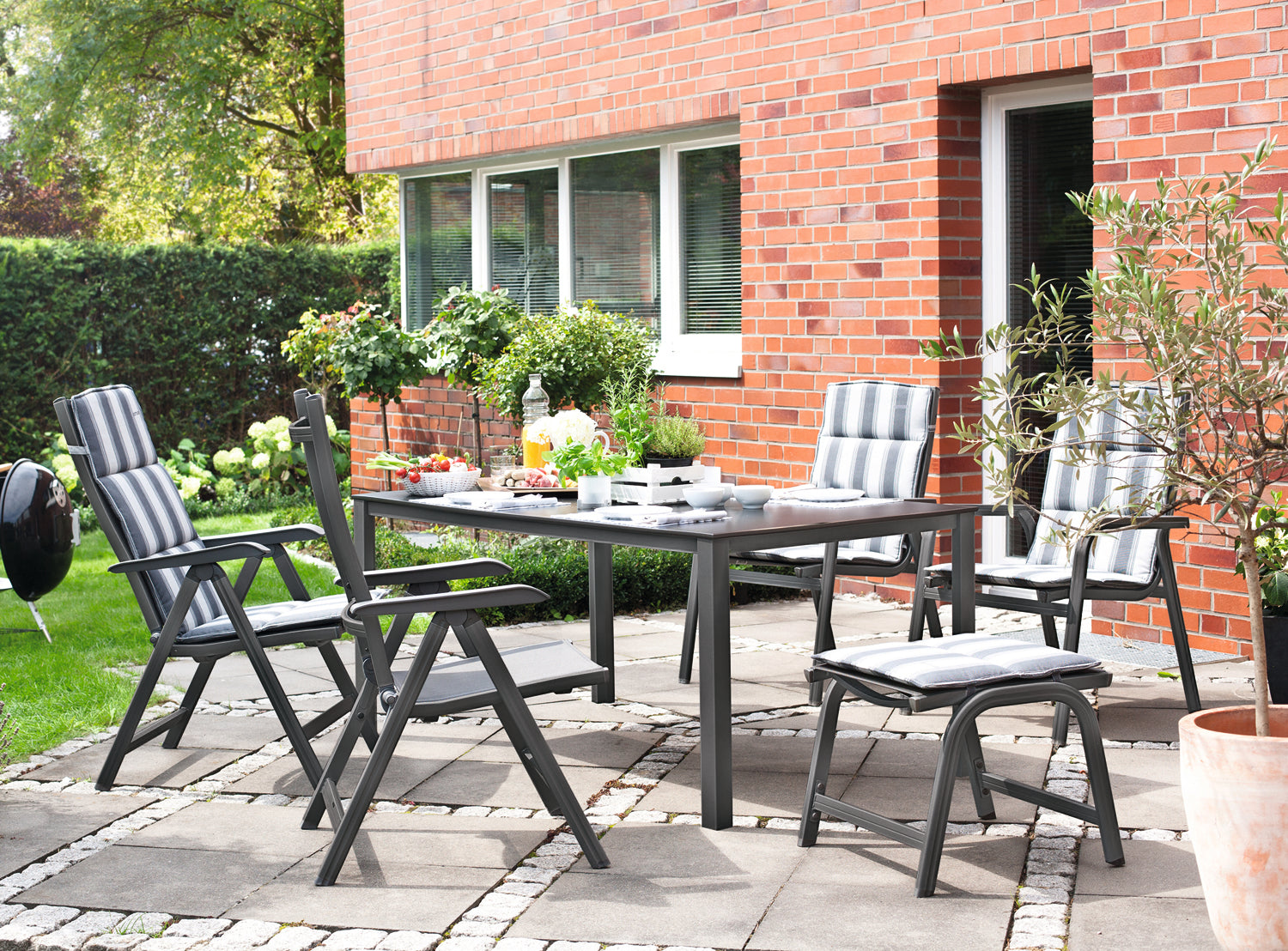 Kettler Basic Plus Outdoor Ottoman around the table