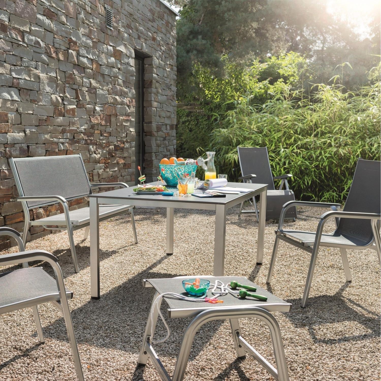 Kettler Basic Plus Outdoor Ottoman around the table and chairs